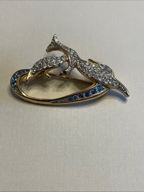 Vintage Swarovski "Freedom Dove" brooch featuring clear and blue crystals